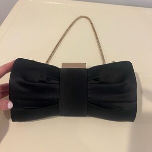 Sondra Robert’s satin bow clutch